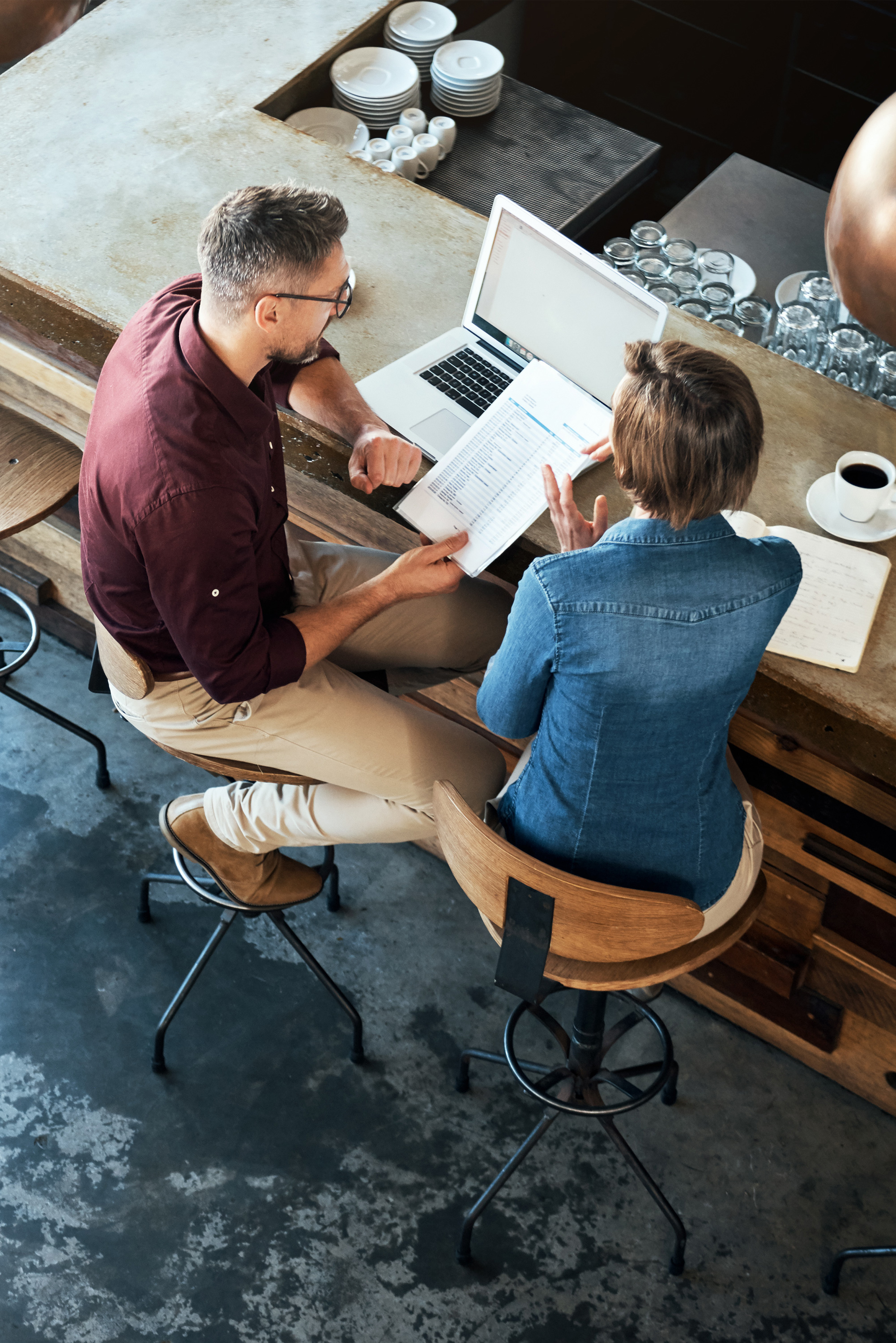 Two business people working in a coffee shop