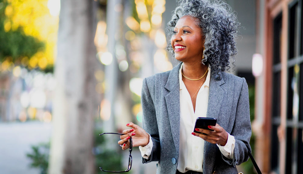 Woman looking at mobile banking app.