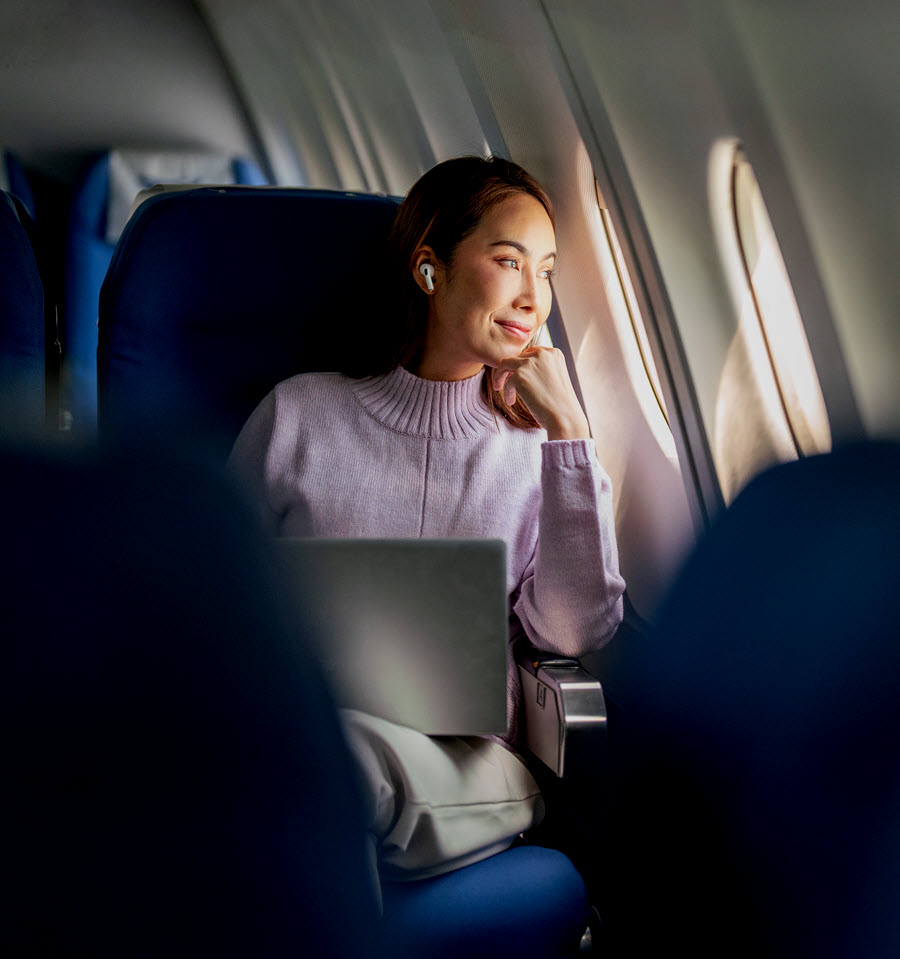 Woman traveling on airplane.